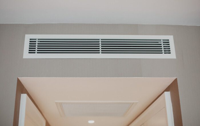 Conditioner air vent grill on the wall.