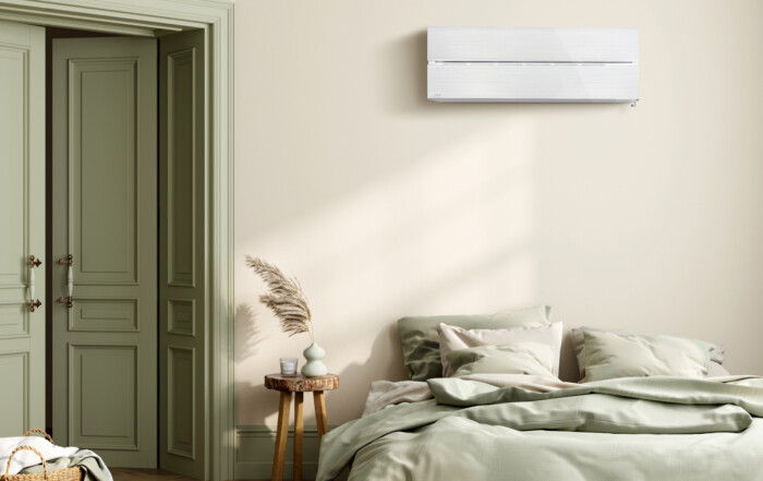 White Mitsubishi Electric high wall heat pump sized for a New Zealand bedroom
